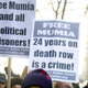 Supporters of inmate Mumia Abu-Jamal rally outside City Hall in Philadelphia Dec. 9, 2006.
Jeff Fusco/Getty Images